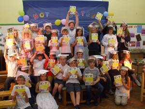 Pupils at Towngate J & I School hold their dictionaries high!